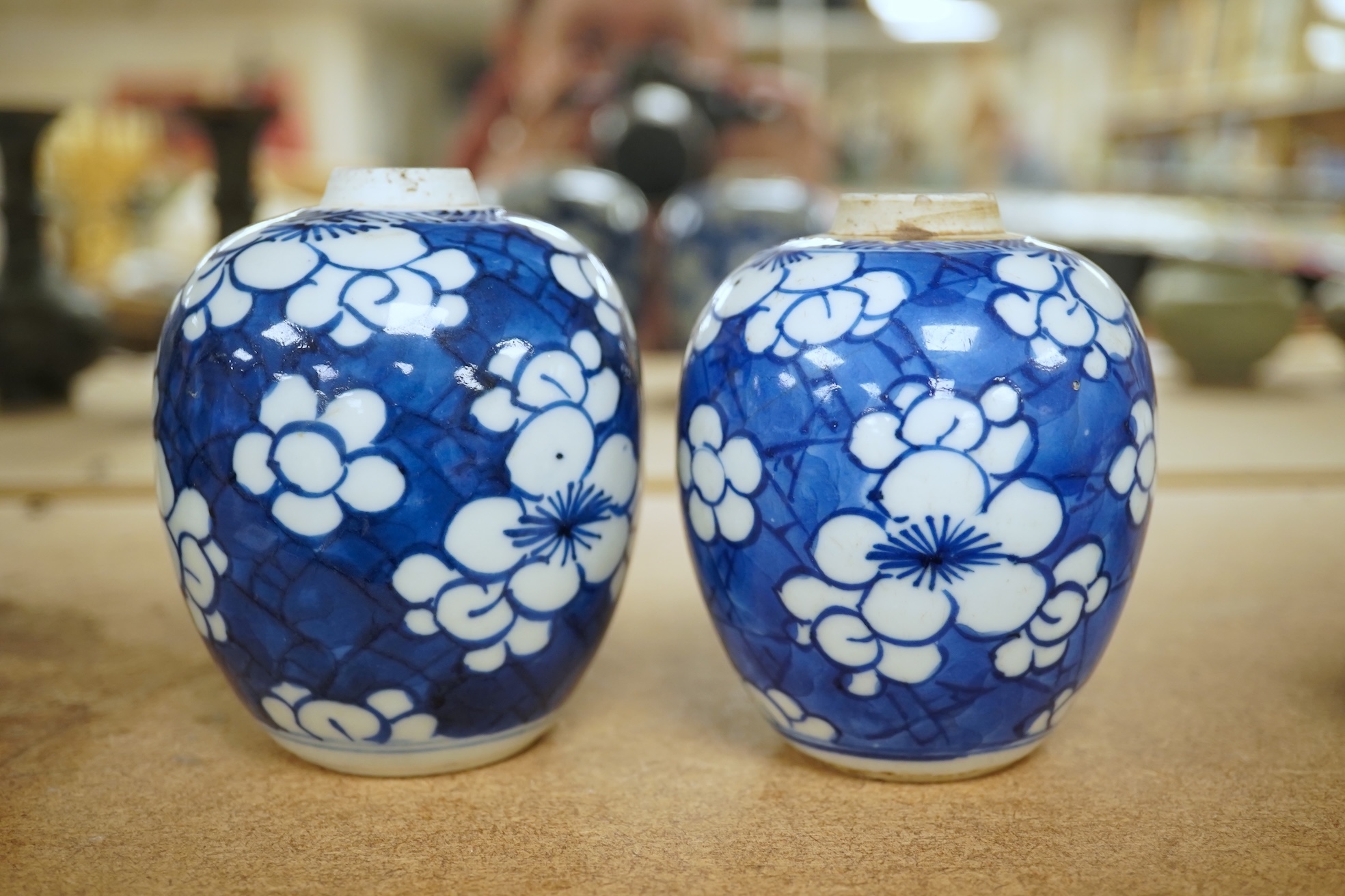 Two small Chinese blue and white prunus jars, Kangxi period, tallest 9.5cm. Condition - good